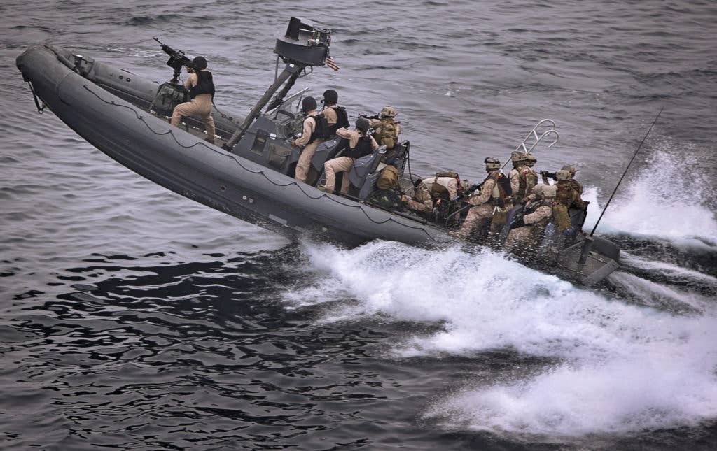 A Navy boat launched from USS New Orleans Aug. 14 carries maritime raid force members of the 11th Marine Expeditionary Unit to a vessel the force's assault element later boarded during counter-piracy and counter-terrorism training. (Lance Cpl. Justin R. Stein)