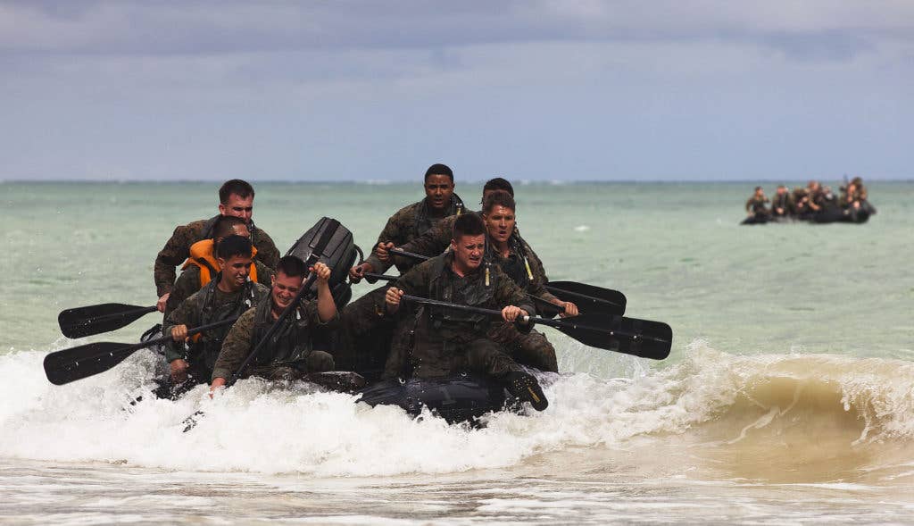 Force reconnaissance Marines with 4th Force Reconnaissance Company paddle toward the beach in F470 Combat Rubber Raiding Crafts during hydrographic reconnaissance training at Marine Corps Training Area Bellows in Waimanalo, Hawaii. (Image Marines)