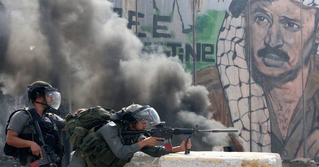Israel Security Forces near the West Bank wall. (Source: Meals Ready to Eat, KCET)
