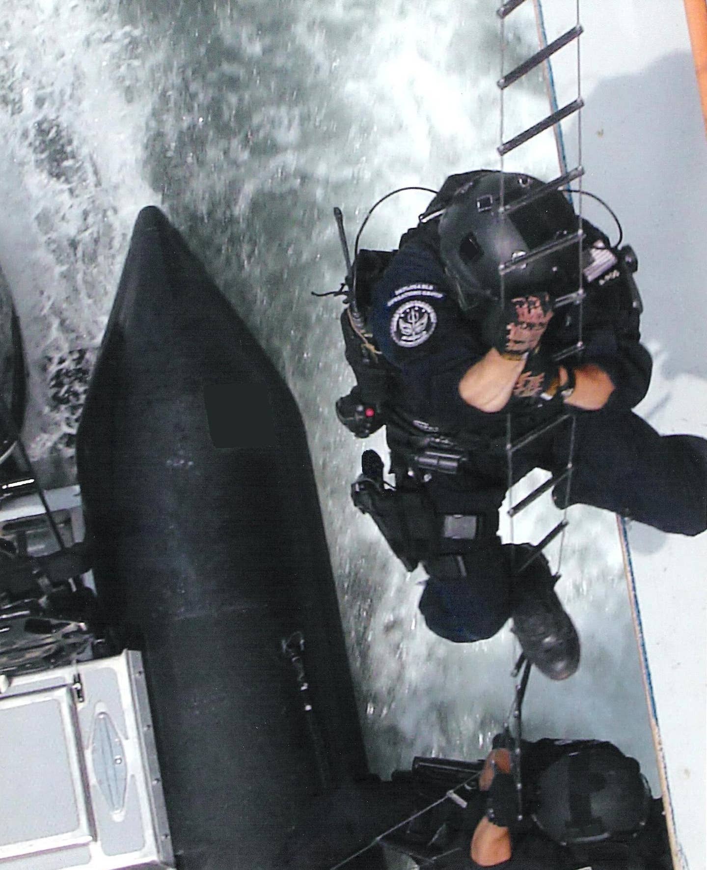 A member of the Coast Guard's Maritime Security Response Team boards a vessel. (Photo from USCG)