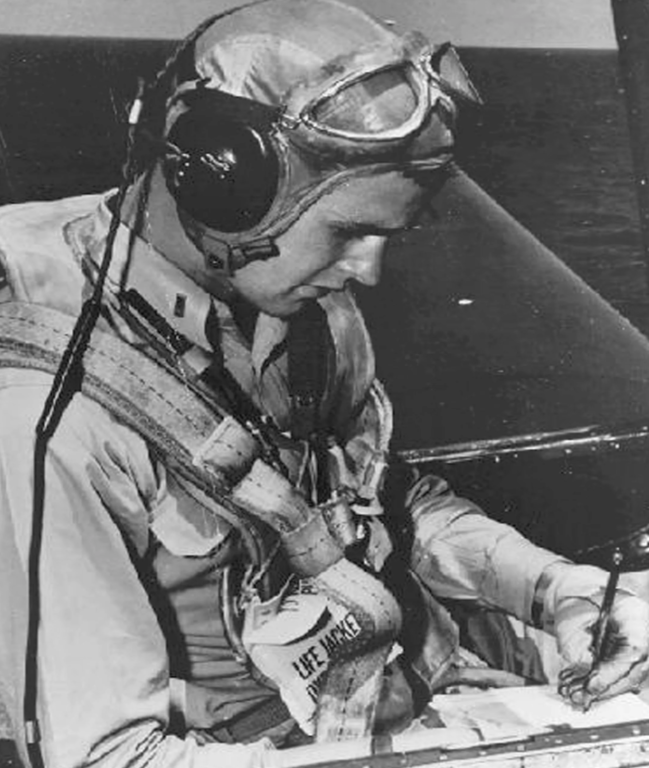 Lt. George H. W. Bush making notes before an air sortie in WWII.