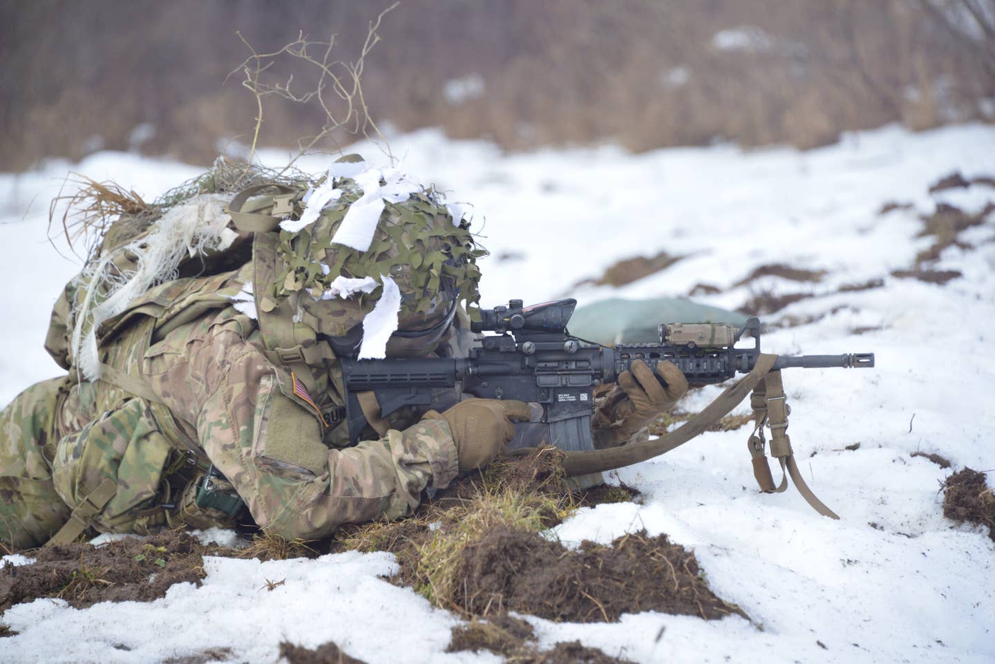 A U.S. Army Paratrooper, assigned to 2nd Battalion, 503rd Infantry Regiment, 173rd Airborne Brigade, engages targets during a recon and sniper break contact live fire exercise at Grafenwoehr Training Area, Germany, Feb. 6, 2017. (U.S. Army photo by Visual Information Specialist Gerhard Seuffert)