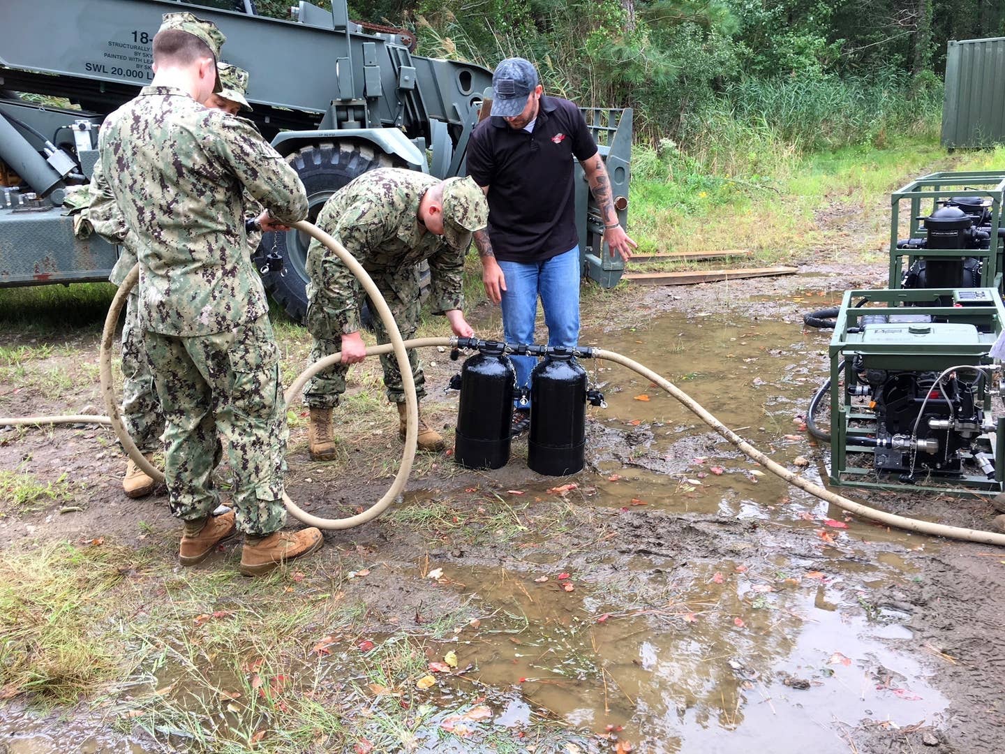Seabees learn how to install nuclear, biological and chemical filters on the lightweight water purification system (LWPS) during training onboard Joint Expeditionary Base Little Creek-Fort Story. (U.S. Navy photo by Chief Builder Wesley Harris)