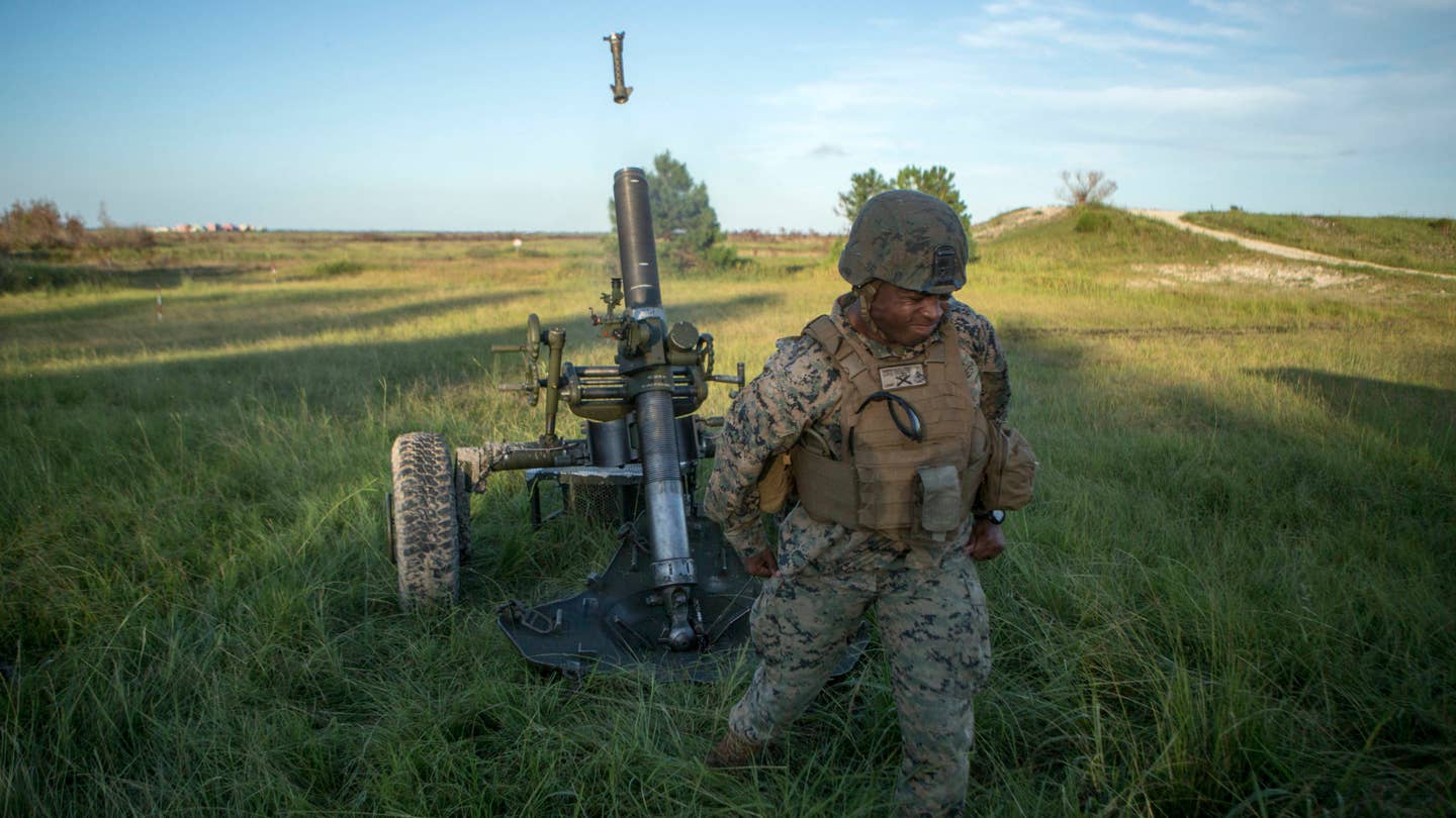 Sgt. Dave Simpson fires an M327 mortar during a live-fire training event at Camp Lejeune, N.C., Aug. 21, 2017. Live-fire training events prepare Marines to face situations they may encounter while in theater combat environment. Simpson is a section chief with 1st Battalion, 10th Marine Regiment. (U.S. Marine Corps photo by Lance Cpl. Damarko Bones)