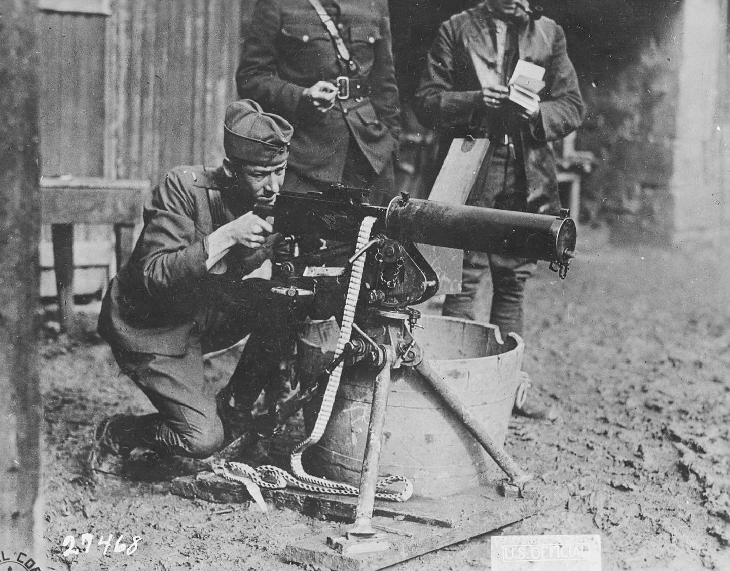 United States Army personnel, including the son of John Moses Browning, fire an M1917 heavy machine gun. (U.S. Army photo)