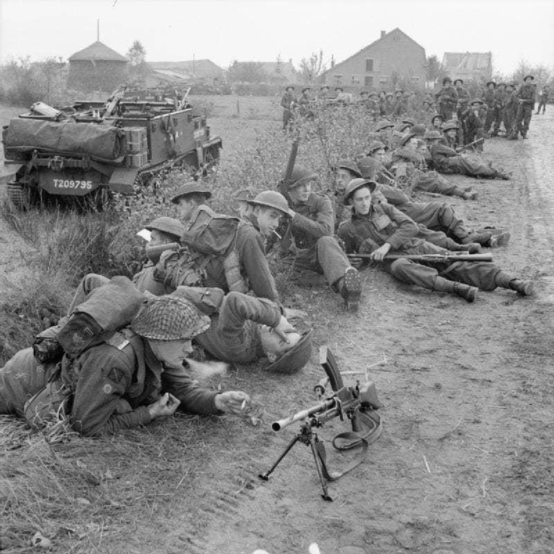 British troops take a rest, with a Bren light machine gun visible on the trail. (Photo from Imperial War Museum)