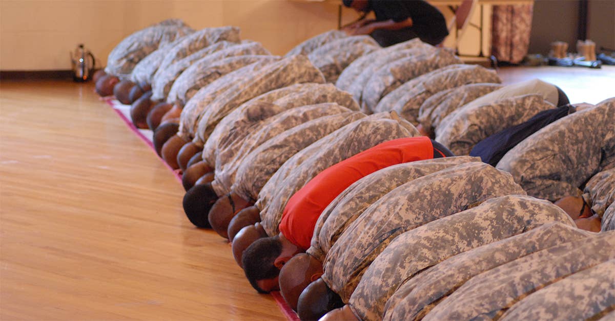 Muslim Soldiers bow down in prayer during the celebration of Eid-Al-Fitr Sunday at the Joe E. Mann Center. Eid-Al-Fitr marks the end of Ramadan, the holy month for Muslims worldwide. (Photo from U.S. Army)
