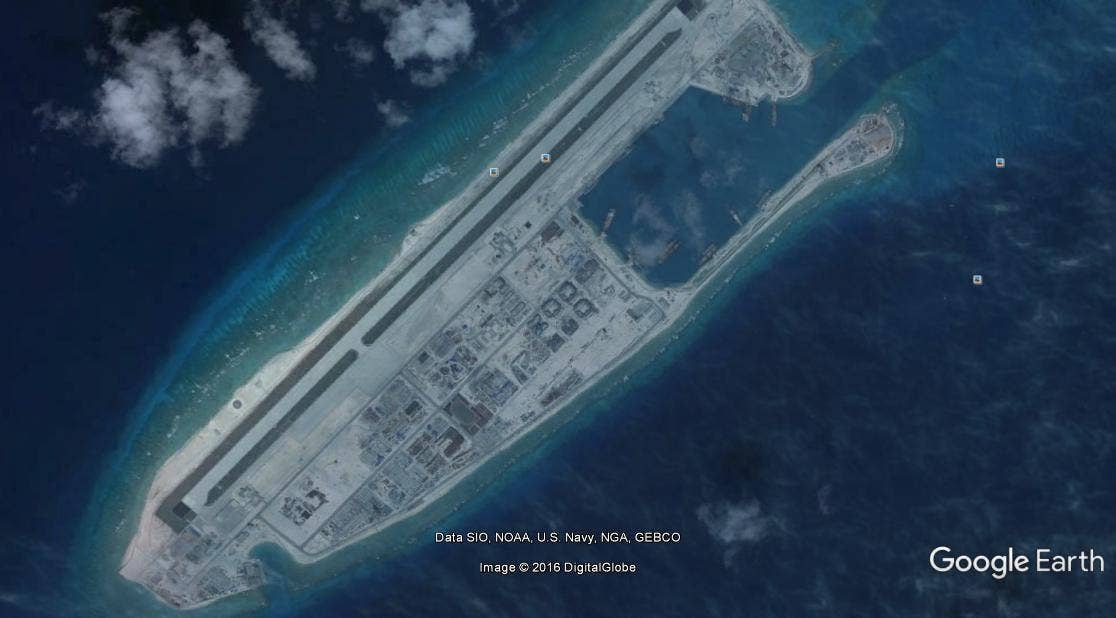 Fiery Cross Reef air base. This air base and others could help bolster China's aircraft carrier, the Liaonang. (Image taken from Google Earth)