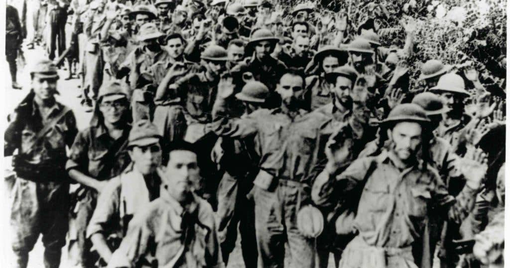 U.S. Army National Guard and Filipino soldiers shown at the outset of the Bataan Death March. (Image from The National Guard Flickr)