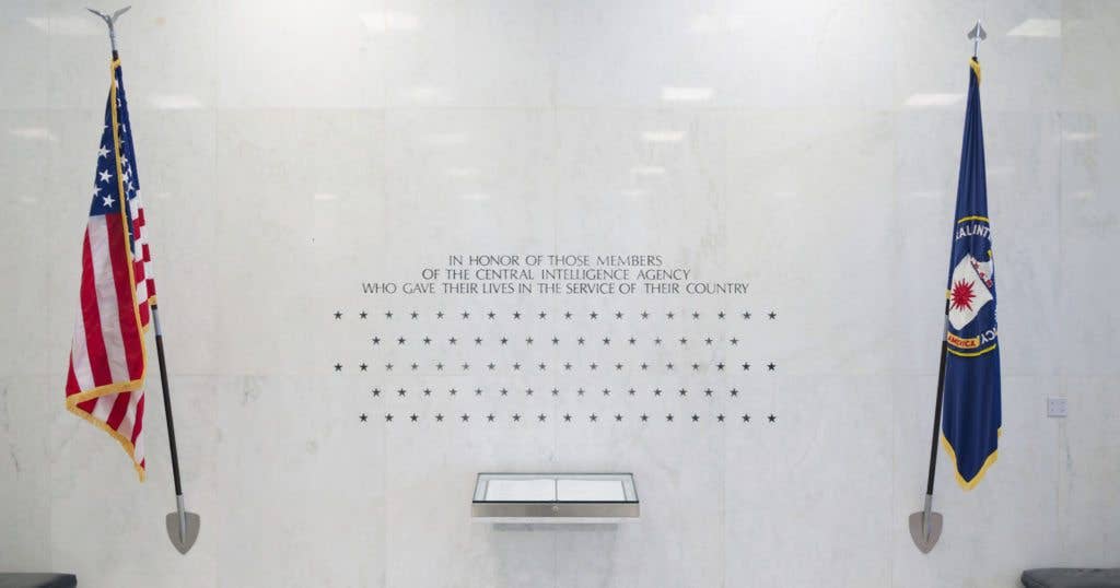 The Memorial Wall is on the north wall of the Original Headquarters Building lobby. This wall of 103 stars stands as a silent, simple memorial to those CIA officers who have made the ultimate sacrifice. The Memorial Wall was commissioned by the CIA Fine Arts Commission in May 1973 and sculpted by Harold Vogel in July 1974. (Image CIA Flickr)
