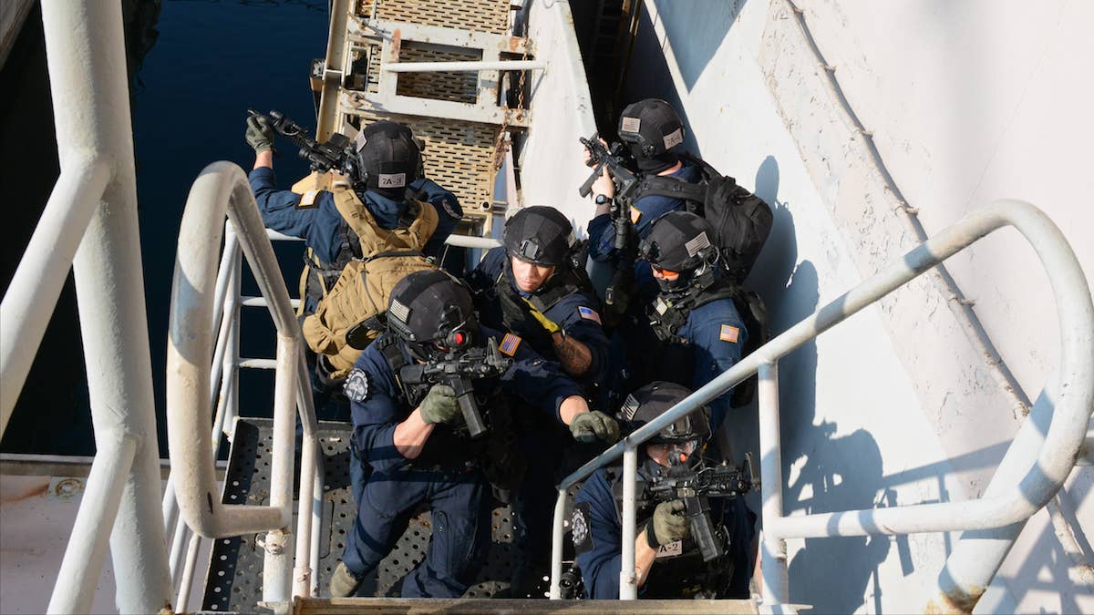 The Coast Guard could help the United States have some fun by having with a boarding party, like the one pictured here during a drill on USS Tarawa. (U.S. Coast Guard photo by Chief Petty Officer Sara Mooers)