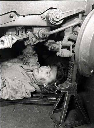 Queen Elizabeth II working as a mechanic during WWII. 