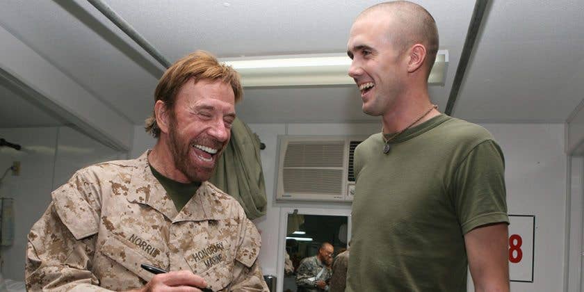 Chuck Norris sharing a laugh with his fellow Marine. (USMC photo by Sgt. Sheila Brooks).