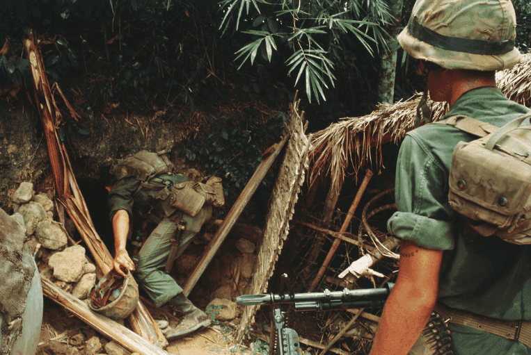 Two U.S. Marines search a Viet Cong tunnel. (Image from Flickr)