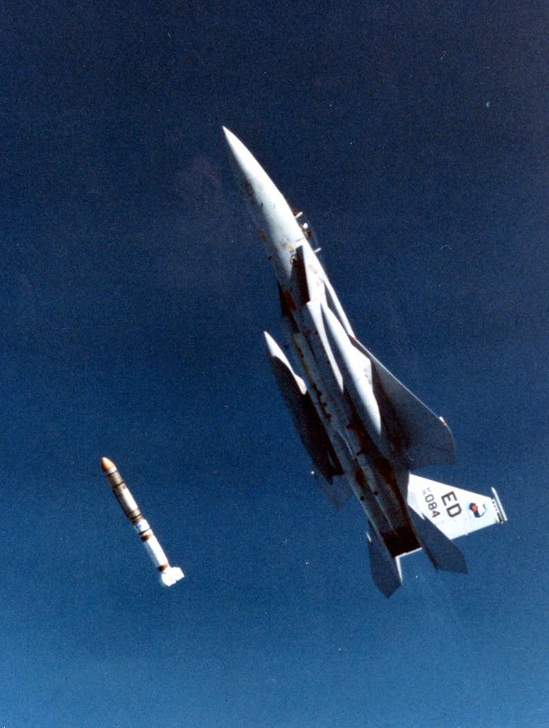 An Air Force F-15 Eagle launches an ASM-135 ASAT at a satellite. The program was cancelled after the successful test due to protests. (USAF photo)