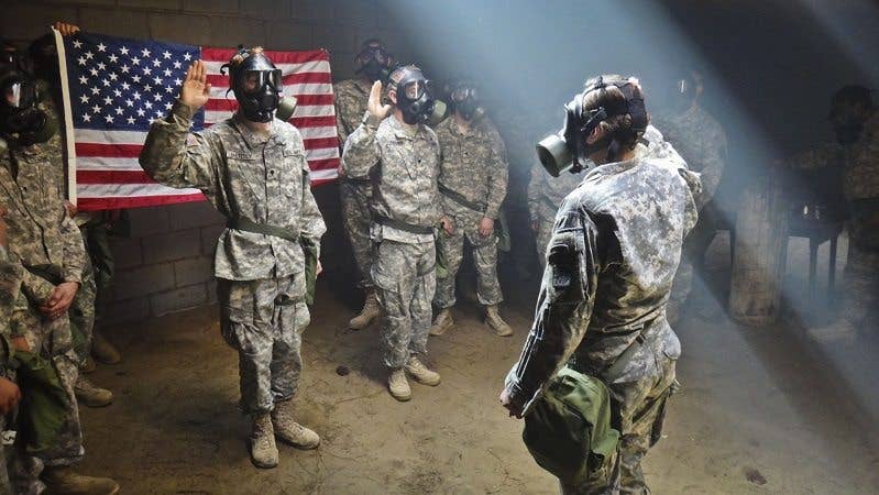 A CS Chamber sounds funny until you have to take your mask off to say the oath... (Photo by Sgt. 1st Class Caleb Barrieau)