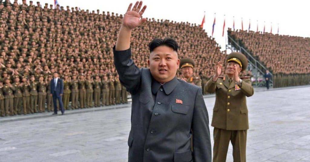 Kim Jong Un waves at North Korean soldiers. (Image KCNA)