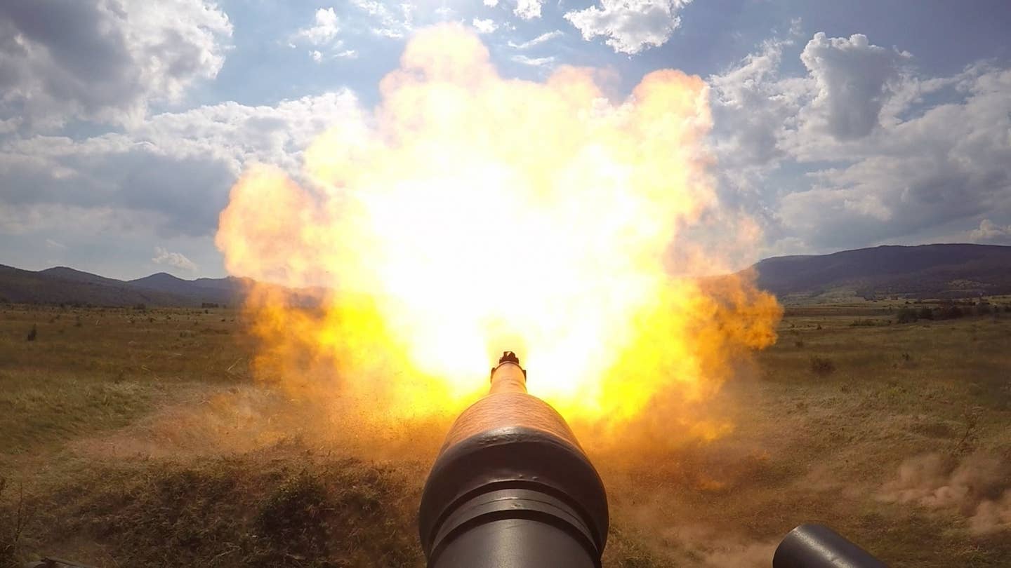 View from an Abrams tank of its 120mm main gun firing. (Photo by US Army)