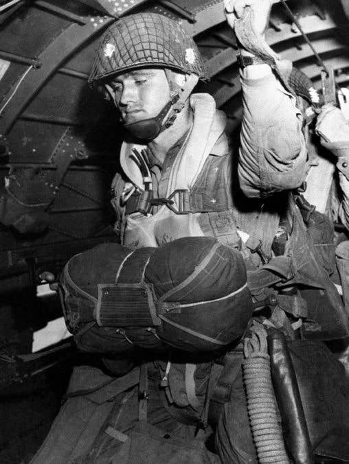 A U.S. Army paratrooper prepares to jump into combat on D-Day, June 1944 (Photo U.S. Army)