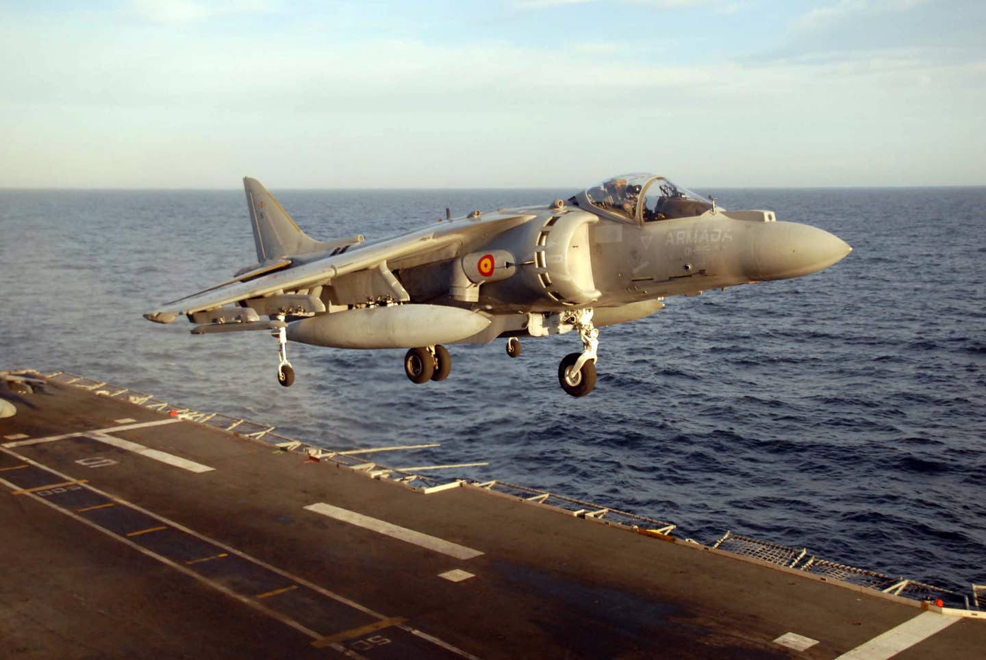 An EAV-8B Harrier II from the Spanish aircraft carrier Principe de Asturias (R 11) prepares to land after a live-fire exercise as part of a passing exercise with ships assigned to Standing NATO Maritime Group Two (SNMG-2). (U.S. Navy photo by Mass Communication Specialist Leonardo Carrillo)
