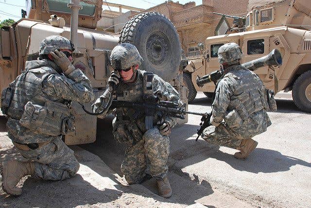 Soldiers with Charlie Company, 1st Battalion, 26th Infantry Regiment, prepare to fire an AT4 rocket launcher at an insurgent position during a firefight in Baghdad's Adhamiyah neighborhood. (U.S. Army photo by Sgt. Mike Pryor, 2nd BCT, 82nd Airborne Division Public Affairs)