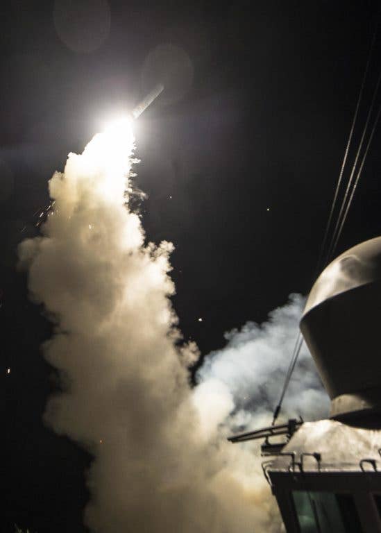 The guided-missile destroyer USS Ross (DDG 71) fires a Tomahawk land attack missile April 7, 2017. Versions of the Tomahawk can attack ships. (U.S. Navy photo)