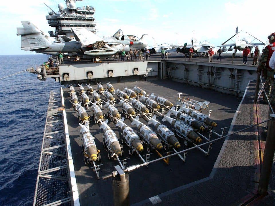 2000 lbs GBU-31 Joint Direct Attack Munitions (JDAM) are transported to the flight deck of USS Harry S. Truman (CVN-75). (US Navy)