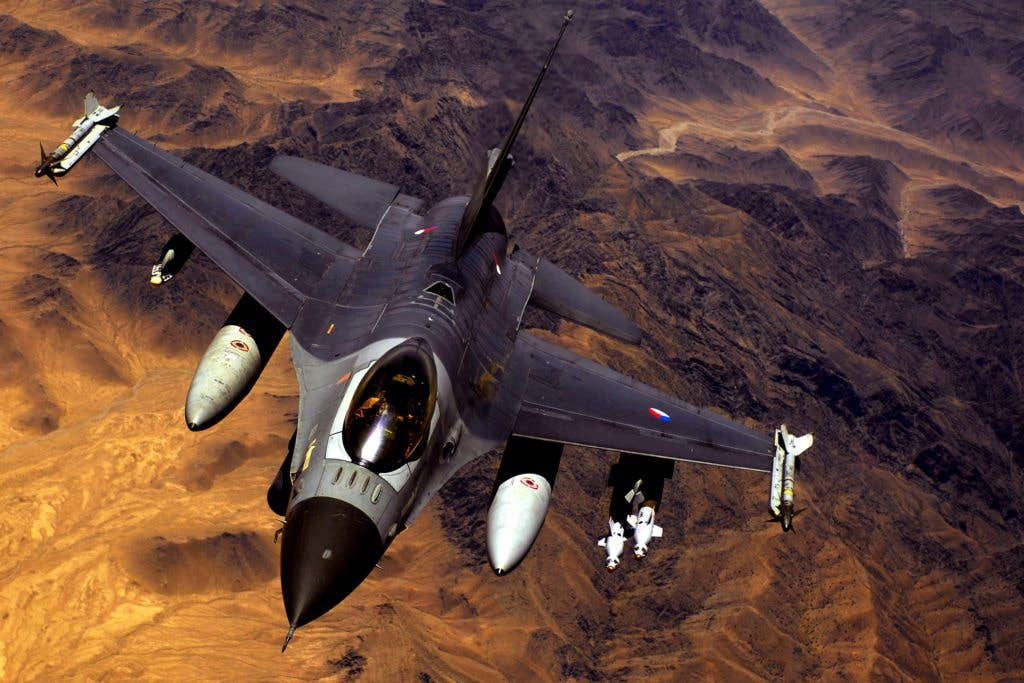 A Royal Netherlands Air Force F-16 Fighting Falcon aircraft conducts a mission over Afghanistan May 28, 2008, after receiving fuel from a KC-135R Stratotanker aircraft. The KC-135R is assigned to the 22nd Expeditionary Air Refueling Squadron, 376th Air Expeditionary Wing deployed from Fairchild Air Force Base, Wash. (U.S. Air Force photo by Master Sgt. Andy Dunaway)