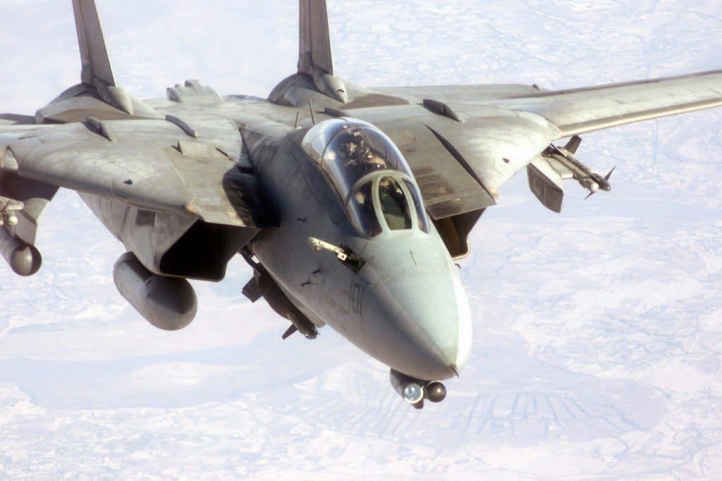 Maverick, Goose, and Iceman made the Tomcat a movie star as a fighter in Top Gun, but in the War on Terror, it was carrying laser-guided bombs to blast terrorists on the ground. (DOD photo)