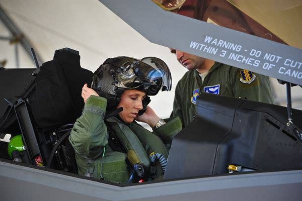 Air Force Lt. Col. Christine Mau readies herself for her first flight in the F-35A Lightning II.