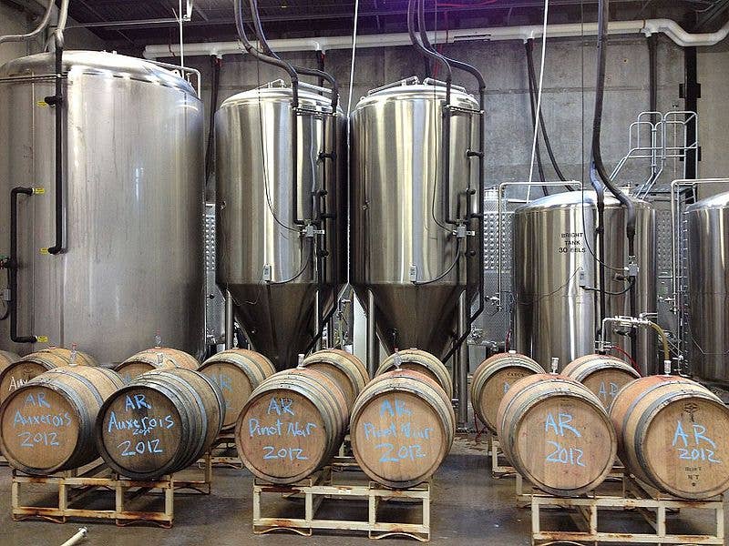 Fermentation tanks and barrels for crafting hard cider. (Photo by Scott Bugni)