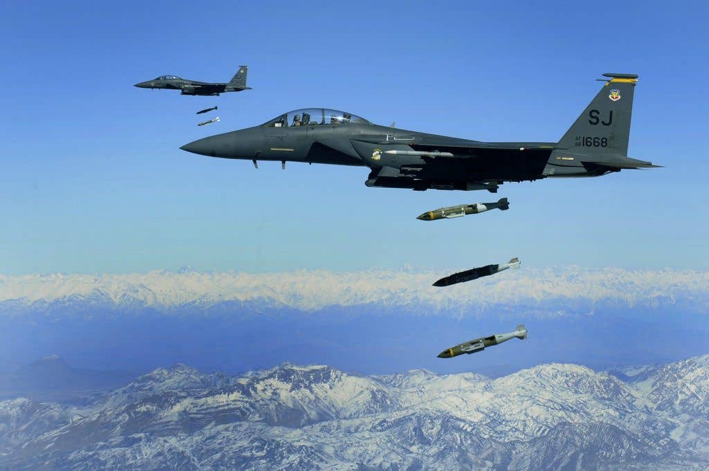 U.S. Air Force F-15E Strike Eagles, from the 335th Expeditionary Fighter Squadron, drop 2,000 pound Joint Direct Attack Munitions on a cave in eastern Afghanistan, Nov. 26, 2009. (U.S. Air Force photo by Staff Sgt. Michael B. Keller)