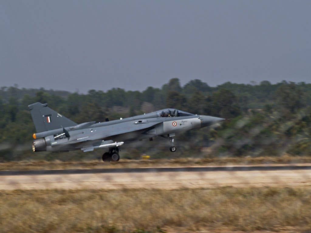 A HAL Tejas takes off during AeroIndia 2009. (Wikimedia Commons photo by Subharnab)