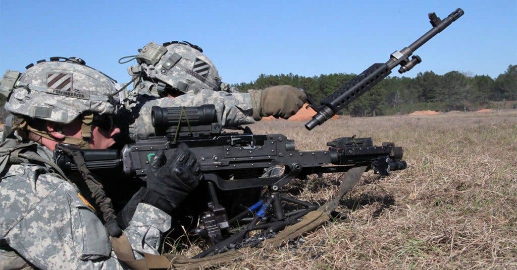 Army infantrymen change barrels on an M240 Bravo machine gun during a live-fire exercise at Fort Stewart, Ga. (U.S. Army photo by Pfc. Jordan Anderson)