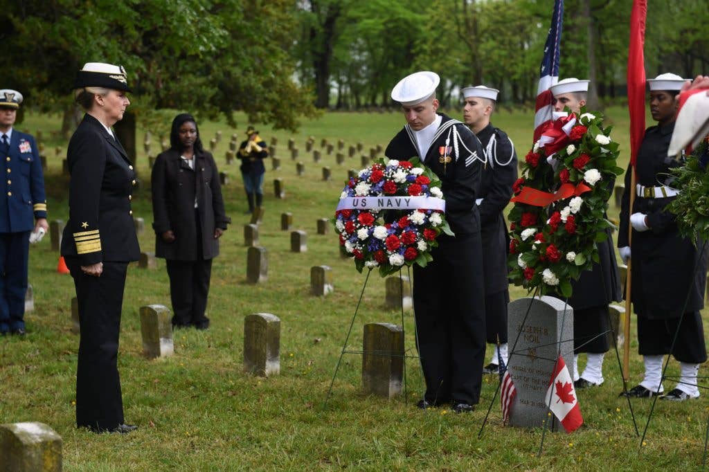 Chief of Navy Reserve Vice Adm. Robin Braun observes the wreath presentation by Sailors assigned to the U.S. Navy Ceremonial Guard at the headstone ceremony April 29, 2016 for Medal of Honor recipient Joseph B. Noil at St. Elizabeths Hospital Cemetery. (U.S. Navy photo by Mass Communication Specialist 2nd Class Eric Lockwood)