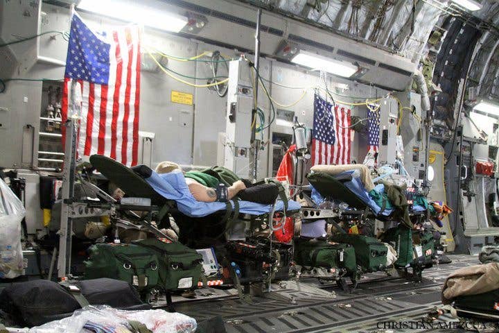 Above, patients have been securely loaded onto a C-17 Loadmaster and await transport to Ramstein AFB.(Photo by Master Sgt. Christian Amezcua)