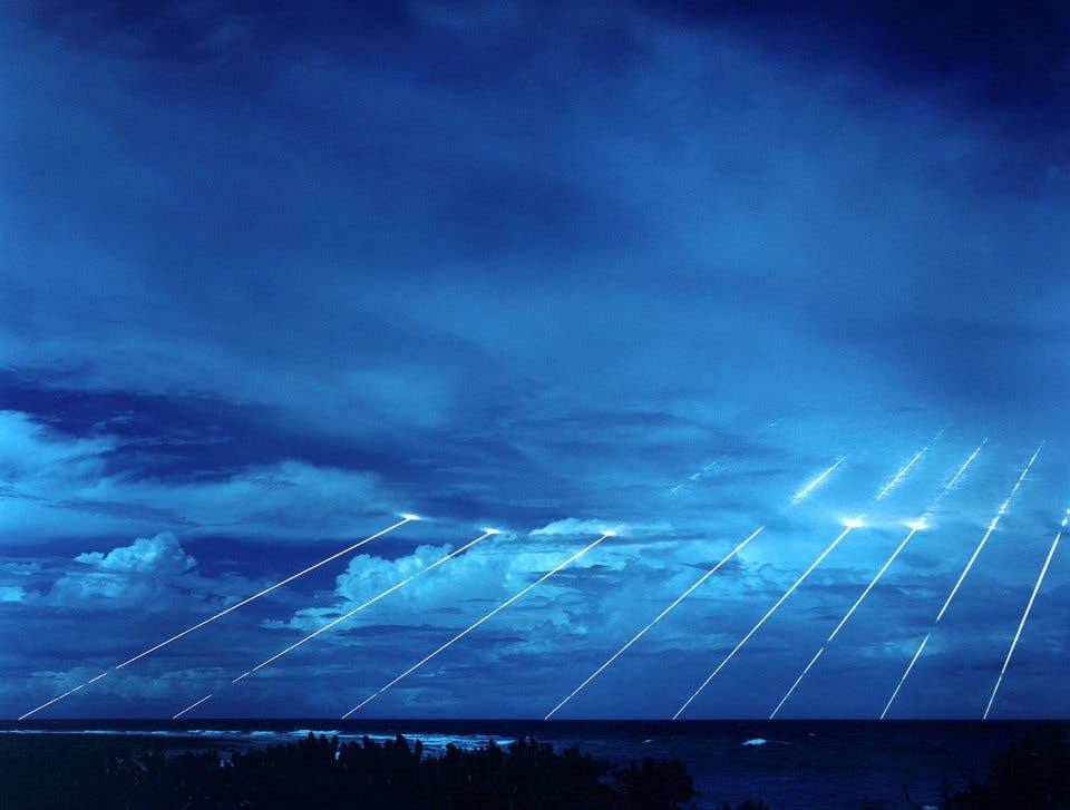 A long exposure of a Peacekeeper missile's mock nuclear warheads blazing back to Earth during a test. (Department of Defense)