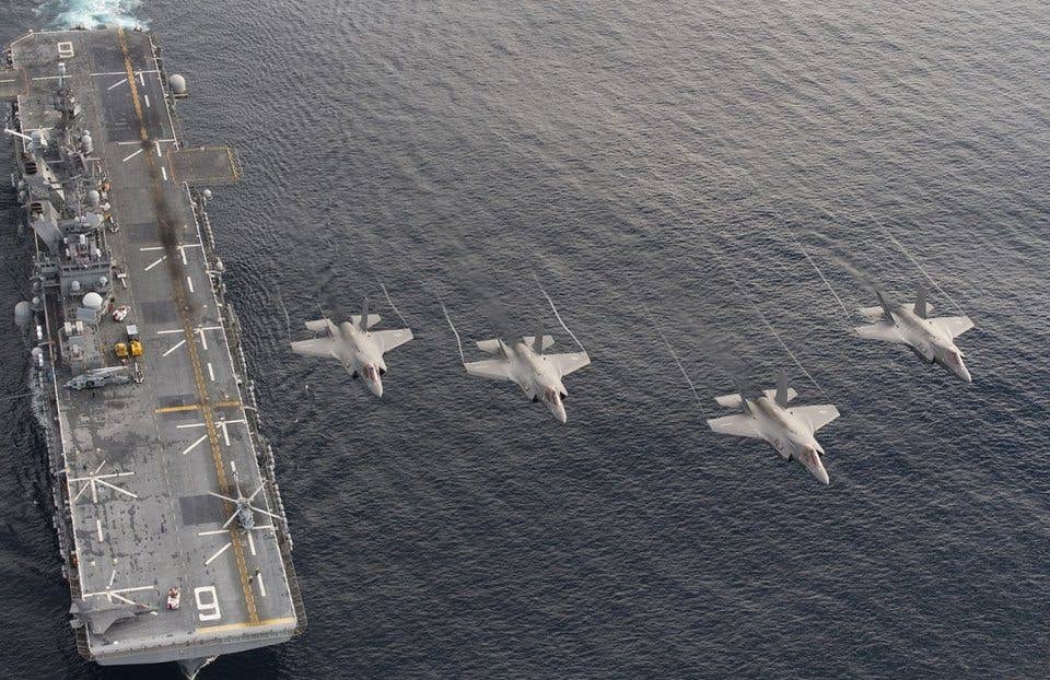 Four F-35B Lightning II aircraft perform a flyover above the amphibious assault ship USS America (LHA 6) during the Lightning Carrier Proof of Concept Demonstration. (US Navy photo by Andy Wolfe)