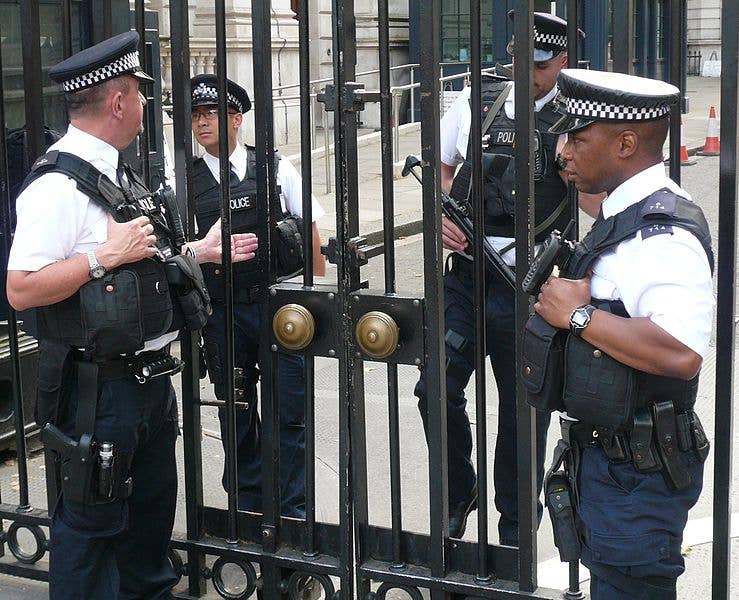 Armed police officers near Downing Street gates. London, Great Britain. (Photo by Stanislav Kozlovskiy)