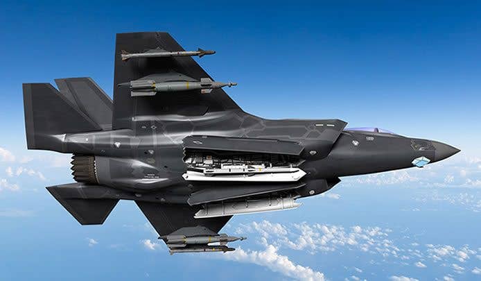 In this artist's rendering, the F-35 Joint Strike Fighter is armed with the AIM-9X Sidewinder missile and the Paveway bomb on both wings, as it prepares to drop the AMRAAM missile.