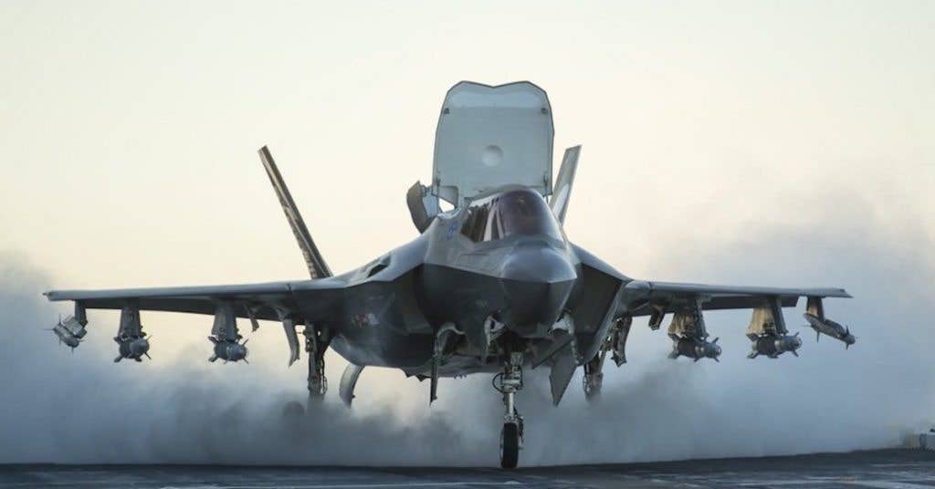 An F-35B begins its short takeoff from the USS America with an external weapons load. (Lockheed Martin)