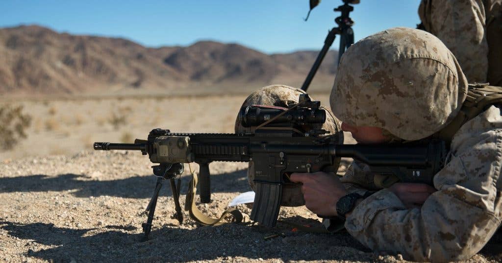 Corporal Jared Ingerson, rifleman, 3rd Battalion, 4th Marines, 7th Marine Regiment, fires his M27 Infantry Automatic Rifle. (Official Marine Corps photo by Lance Cpl. Levi Schultz)