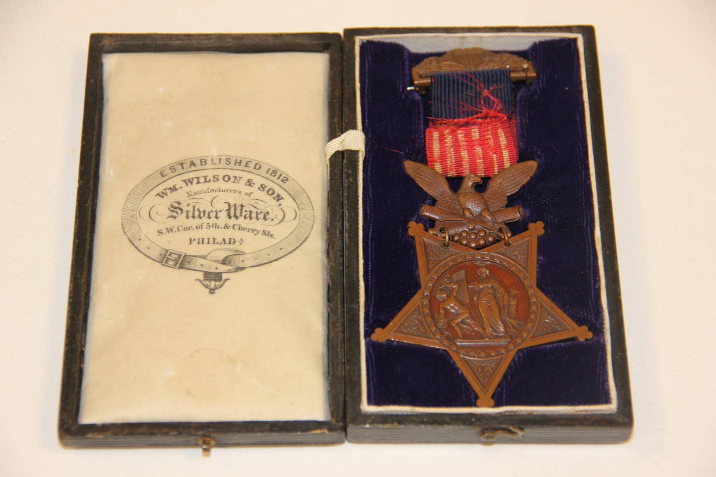 Above, an original design of the Medal of Honor.