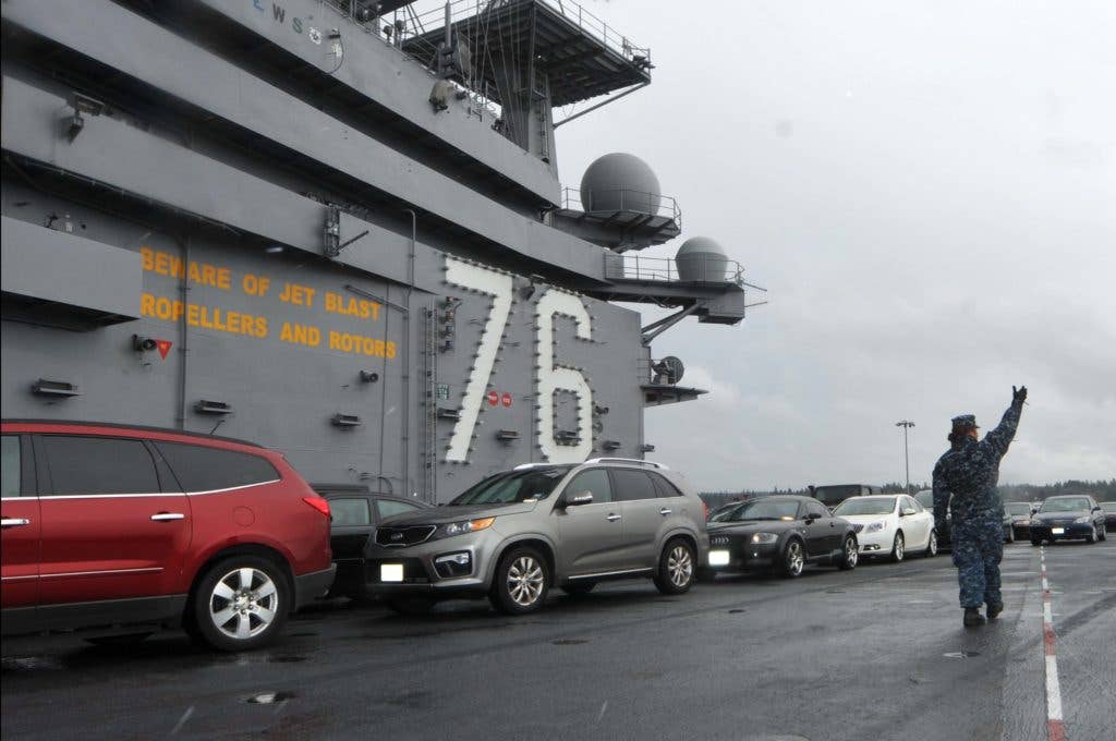 Sailors direct the movement of vehicles on the flight deck of the aircraft carrier USS Ronald Reagan (CVN 76). (U.S. Navy photo by Mass Communication Specialist 3rd Class Charles D. Gaddis IV)
