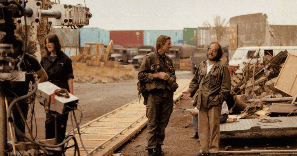 Stanley Kubrick (right) discusses a scene with Matthew Modine (center). (Warner Brothers)