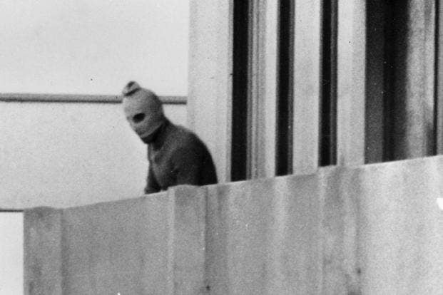 PLO terrorist on a balcony in the Olympic Village, Munich 1972.
