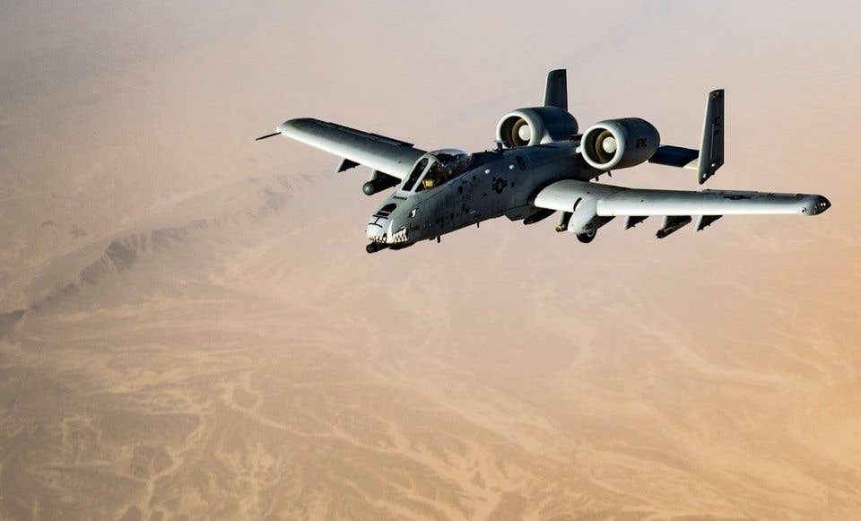 An A-10 Thunderbolt II pilot maneuvers into formation while waiting for his wingman to conduct refueling operations with a KC-135 Stratotanker over Afghanistan on March 12, 2018. (DVIDS)