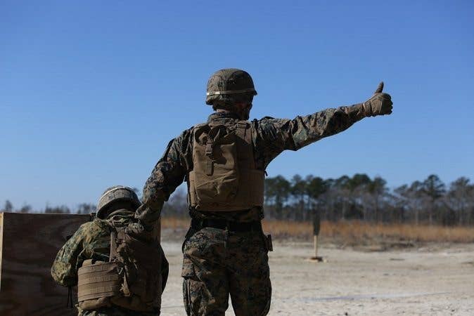 All you have to do is give a thumbs-up and pay attention. It's easy. (U.S. Marine Corps Photo by Pfc. Heather Atherton)