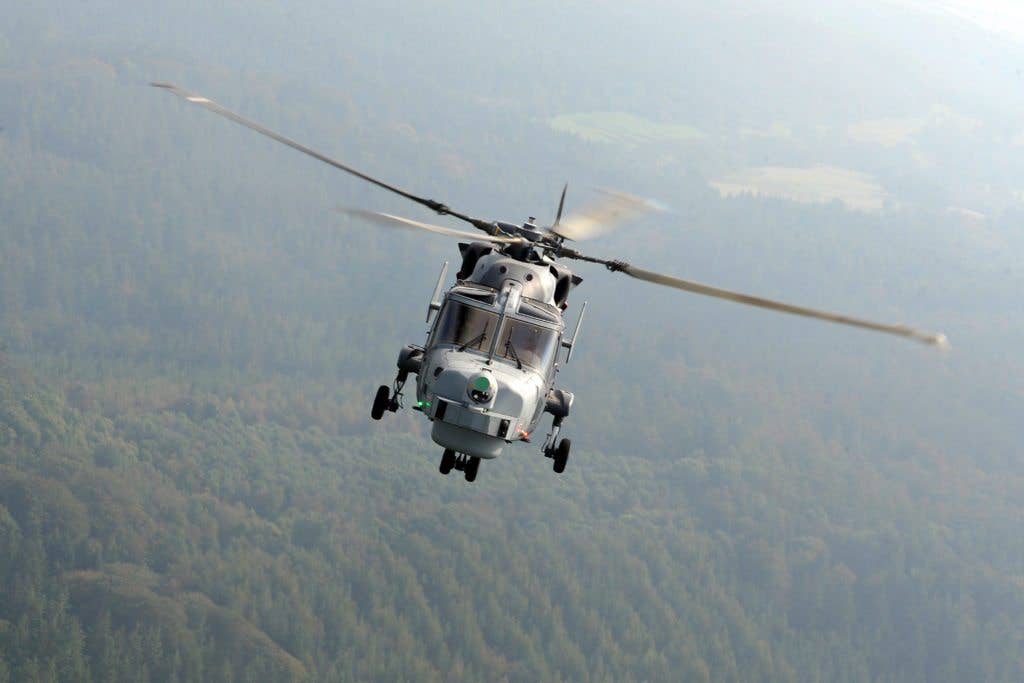 A Royal Navy Wildcat helicopter from 825 Naval Air Squadron (NAS) in flight over the UK. This helicopter can go 184 miles per hour, making it one of the fastest in the world. (Royal Navy photo)