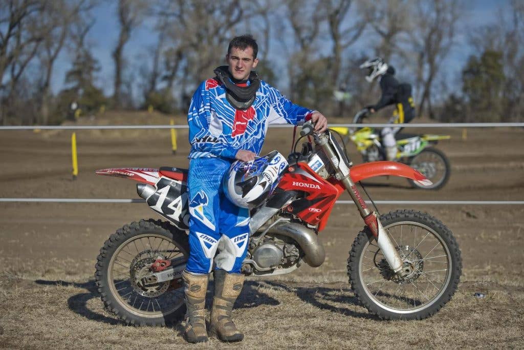 2nd Lt. Michael Reardon poses in front of a race track in Maize, Kan. Reardon has competed in motocross races for nearly three years and has been riding since he was 10 years old. (U.S. Air Force photo)